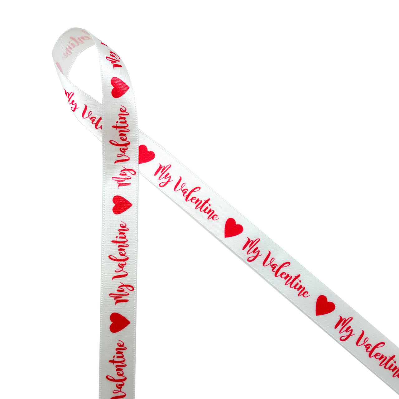 My Valentine in red with red hearts printed on 5/8"white single face satin ribbon is a fun expression of love and affection for anyone on Valentine's Day. This is a fun ribbon for gift wrap, gift baskets, party favors, candy shops and chocolatiers. Use this ribbon on cookie favors, cake pops and sweets tables too! All our ribbon is designed and printed in the USA