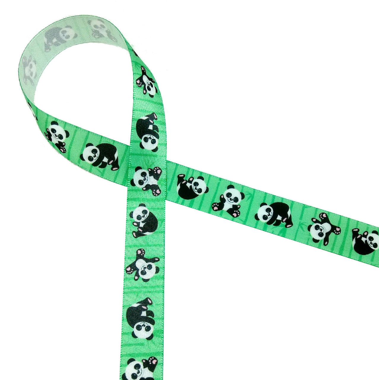 Panda bears tumbling along on a green bamboo background are so much fun! Printed on  5/8" white single face satin, who wouldn't want to invite them to the party!