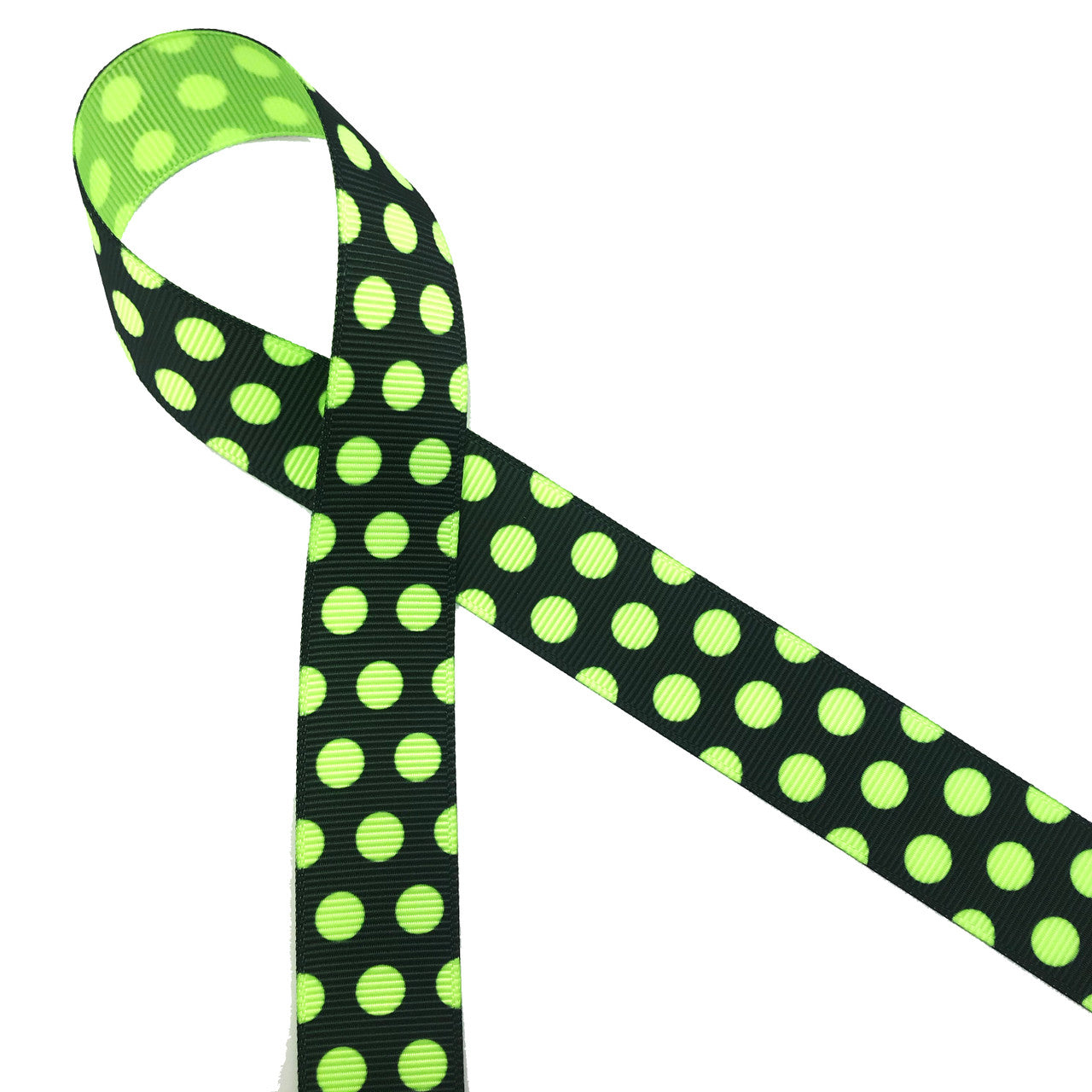 Neon green polka dots on a black background printed on 7/8" neon green grosgrain ribbon makes for a fun and scary Halloween ribbon for hair bows, decor and treats! Be sure to have this ribbon in your Halloween collection! Designed and printed in the USA