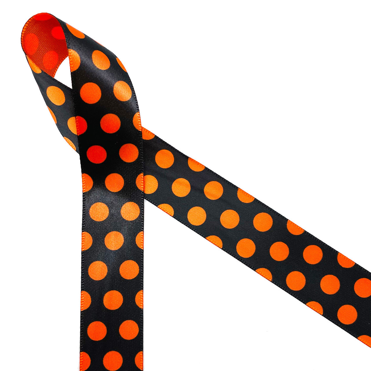 Nothing says Halloween like black and orange dots! Orange polka dots on a black background printed on 7/8" orange satin ribbon is a Halloween tradition. This Halloween classic design is ideal for party decor, party favors, gift wrap, gift baskets, treat bags, candy shops, bakeries, cookies and cake pops! This is a great design for Halloween crafts, wreaths, sewing and quilting projects. All our ribbon is designed and printed in the USA