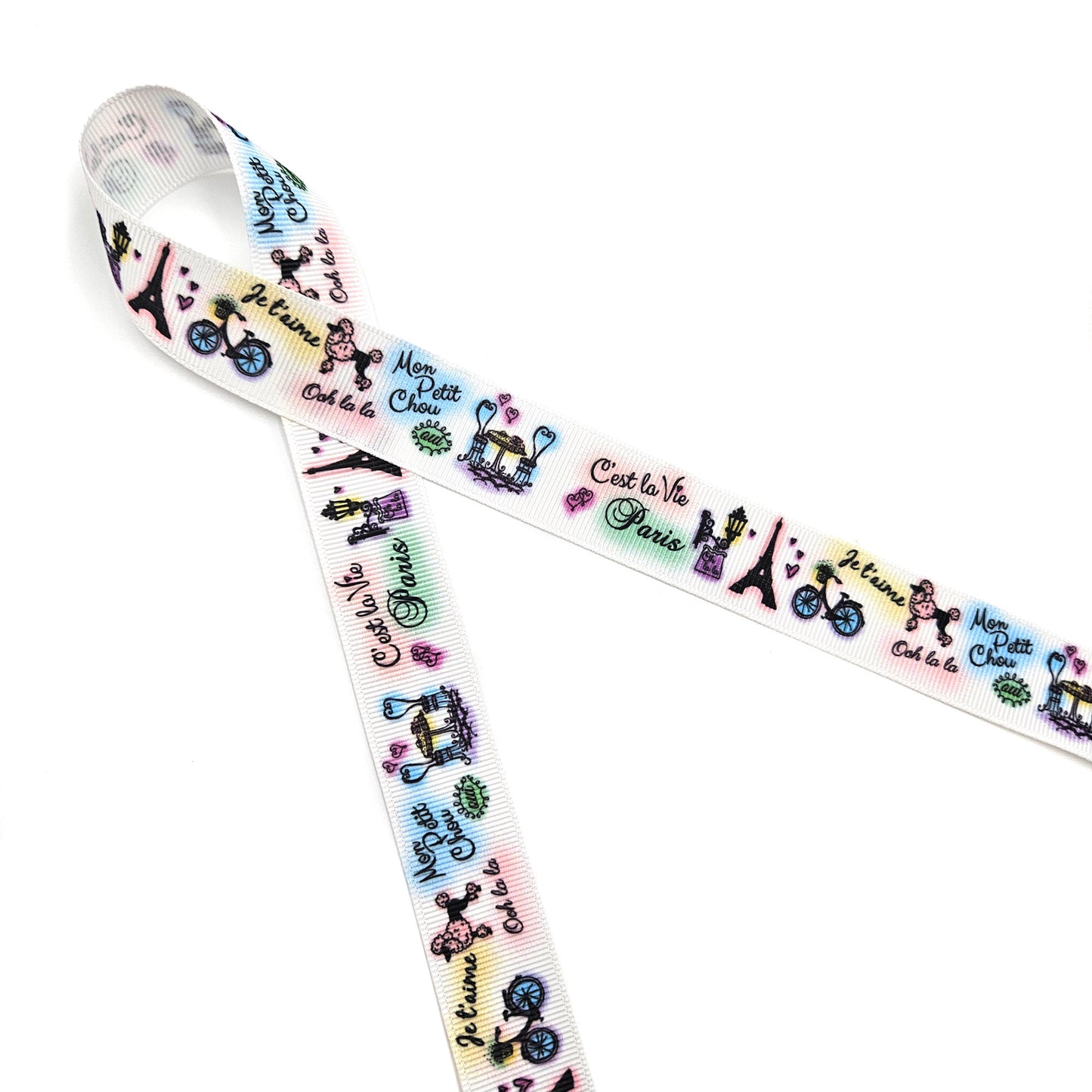 Paris ribbon with images of Paris scenes printed on 7/8" blush double face satin and grosgrain