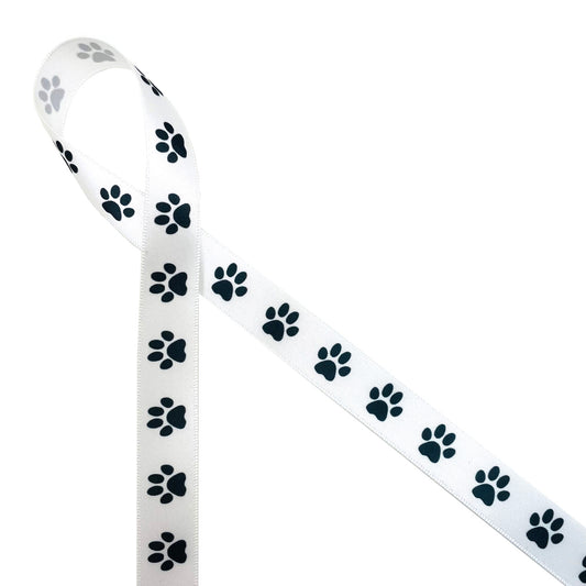 Paw prints in a row in black and white printed on 7/8" white single face satin ribbon is the perfect ribbon for pet gifts, pet gift baskets, pet themed parties and crafts! This is also a great ribbon for tying a gift for the pet sitter, pet groomer or your favorite  Veterinarian! All  our ribbon is designed and printed in the USA