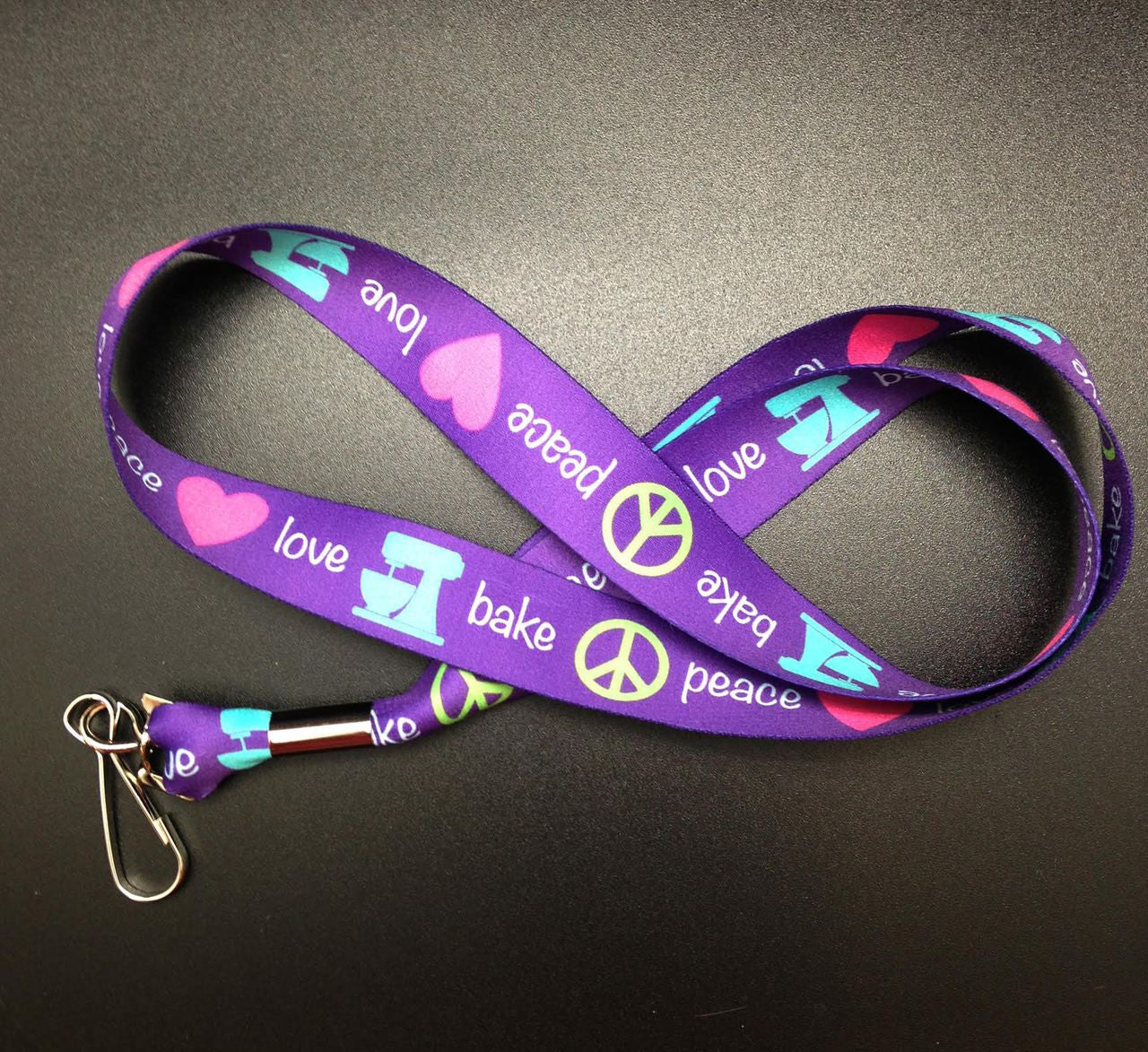 Peace, Love, Bake Lanyard in purple, pink, teal and lime on 1" Webbing