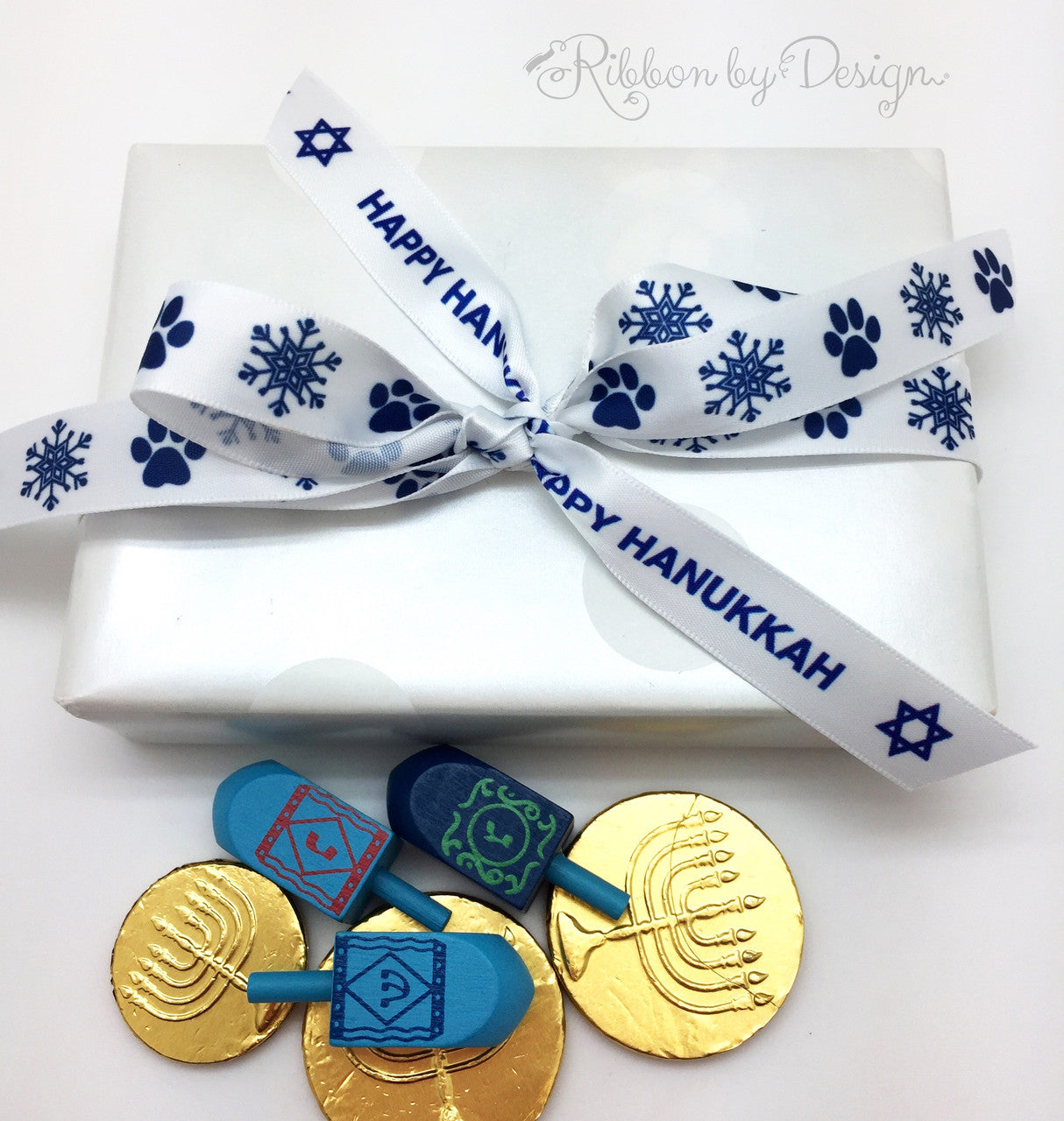 Paw prints ribbon with snowflakes in royal blue printed on 5/8"white single face satin