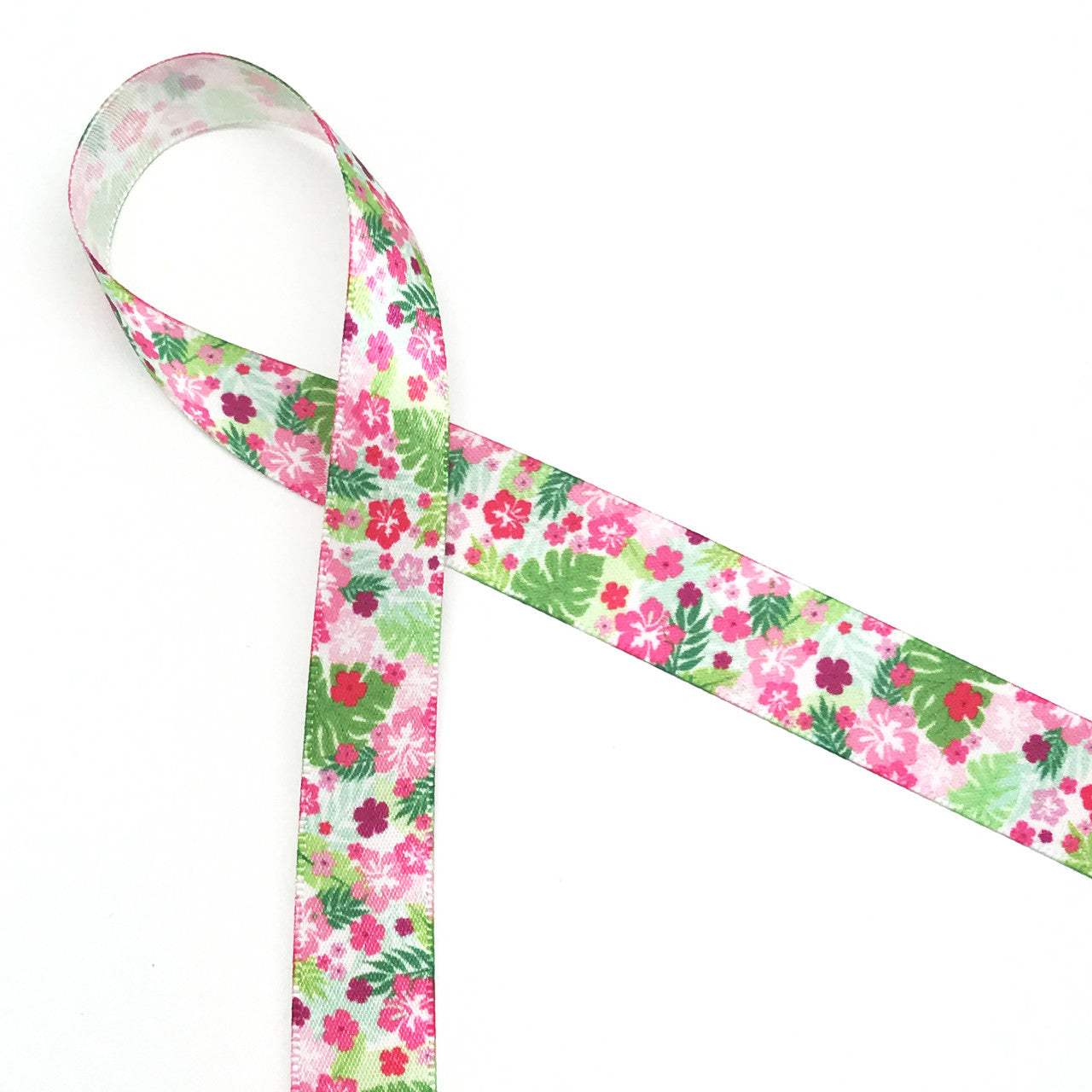 Lily inspired ribbon pink and green floral featuring hot pink flowers and green ferns and palm fronds printed on 5/8' white single face satin  is the perfect ribbon for any Summer party, bridal shower, tea party or Mother's Day brunch. This is an ideal ribbon for party favors, party decor, gift wrap, table decor, cookies, cake pops and desserts. Use this ribbon for Summer crafts, hair bows, head bands, sewing and quilting projects too. All our ribbon is designed and printed in the USA