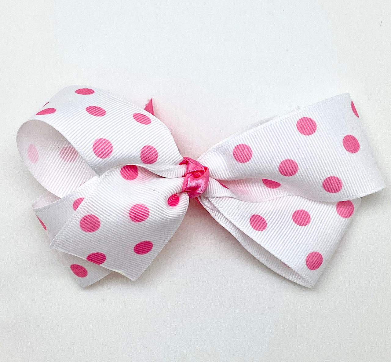 Our pink polka dots on 1.5" white grosgrain makes the cutest little hair bows! The sweetest design for every little girl!