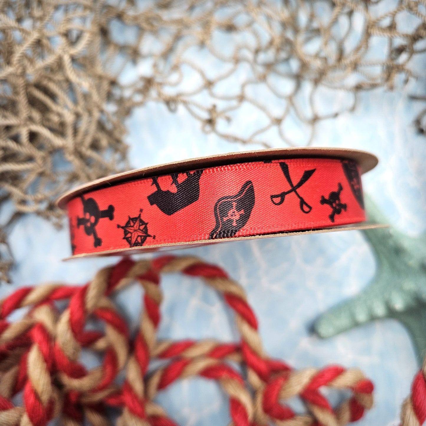 Pirate Ribbon silhouettes in black on 5/8" red single face satin ribbon