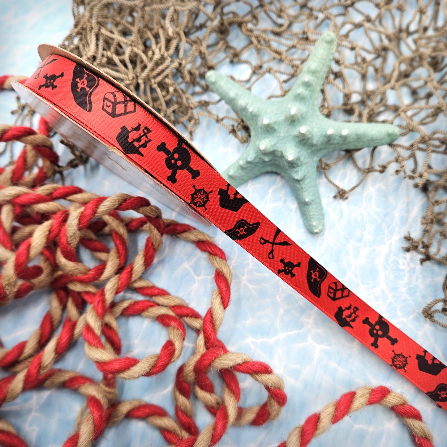 Pirate Ribbon silhouettes in black on 5/8" red single face satin ribbon