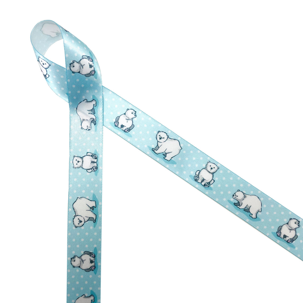 Polar bear ribbon featuring baby Polar bears sitting and standing on a light blue background with white polka dots printed on 5/8" white single face satin ribbon is the perfect ribbon for baby gifts, baby showers, baby reveal parties and Christmas! Every Polar Bear  lover will appreciate this sweet tie on gift wrap, gift baskets, shower favors, Christmas gifts, craft projects and quilting. All our ribbon is designed and printed in the USA