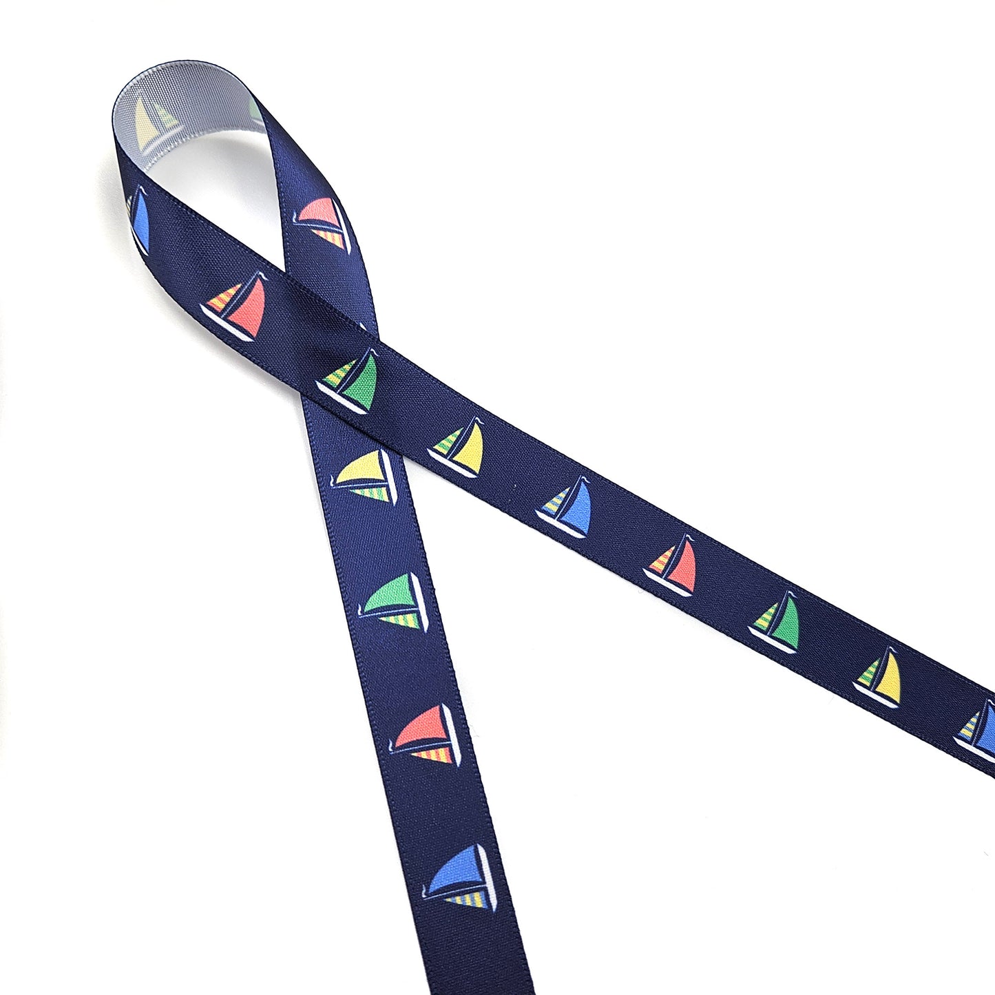 Sailboat ribbon with sales of green, yellow, blue and red printed on 5/8" and 7/8" satin and grosgrain