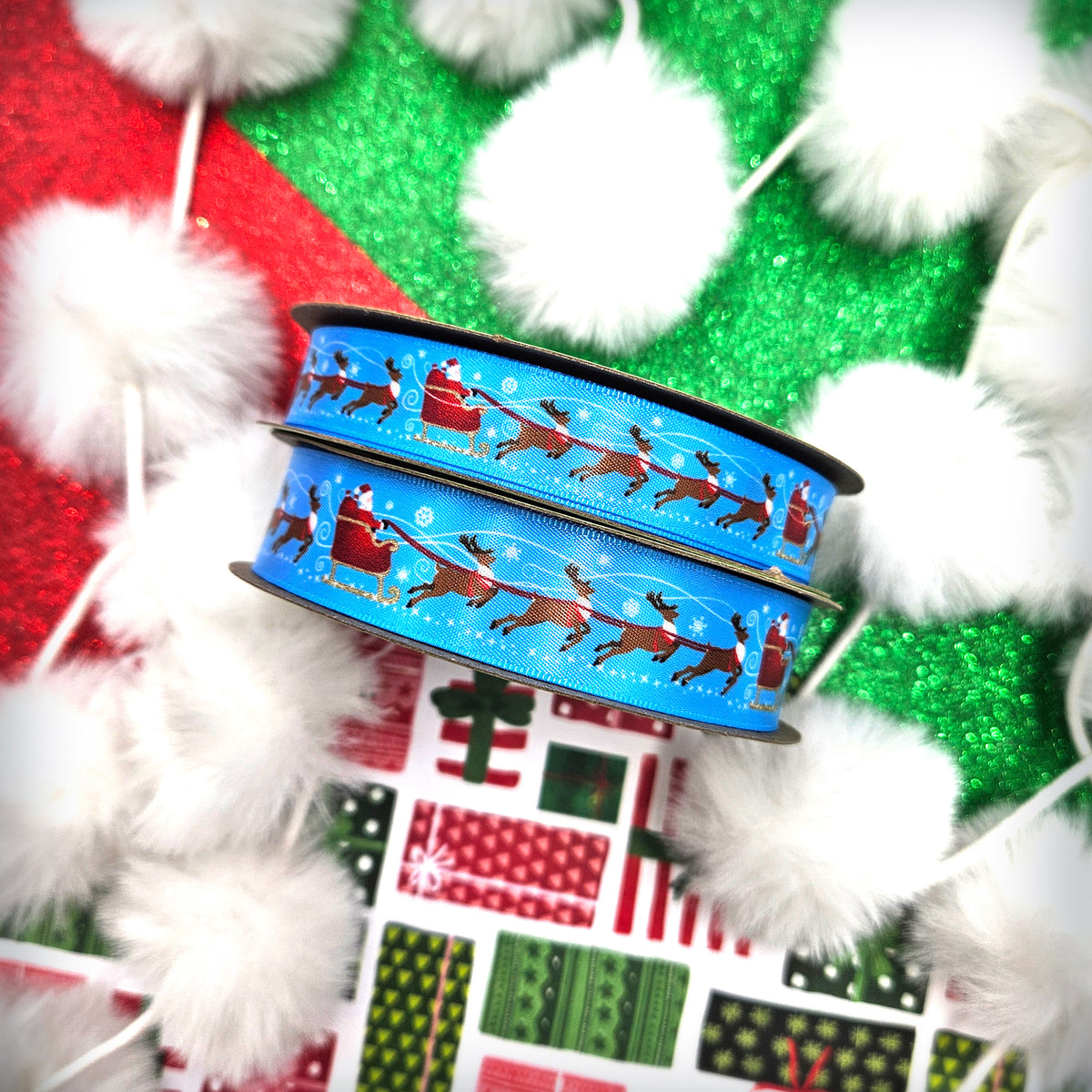 Christmas ribbon Santa with eight tiny reindeer and his sleigh on a light blue background printed on 5/8" and 7/8" satin