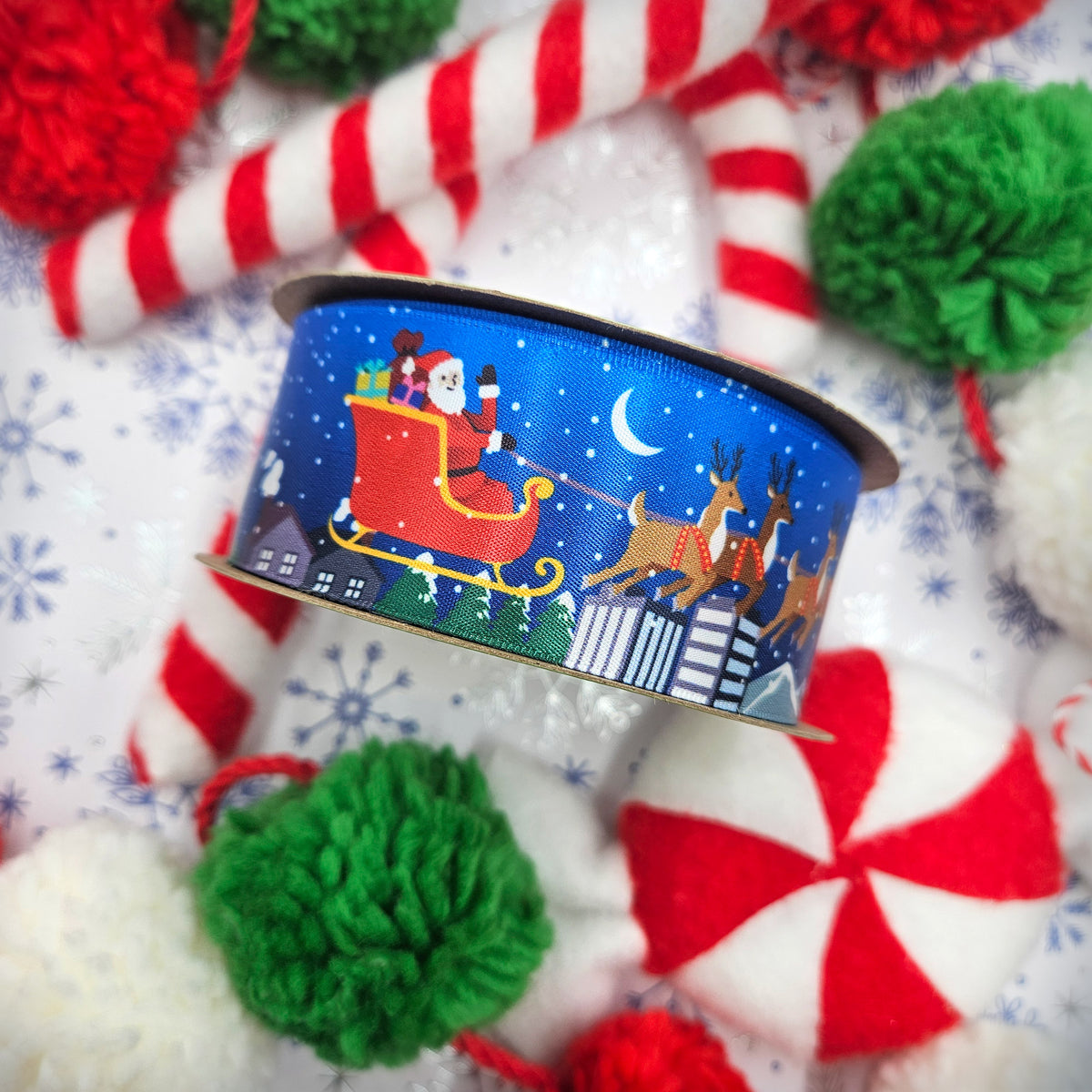 Santa and his sleigh with reindeer Christmas on a blue background printed on 1.5" white satin ribbon