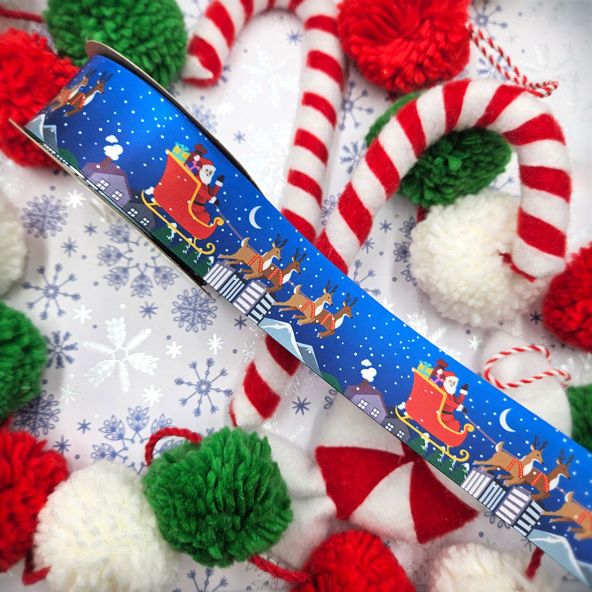 Santa and his sleigh with reindeer Christmas on a blue background printed on 1.5" white satin ribbon