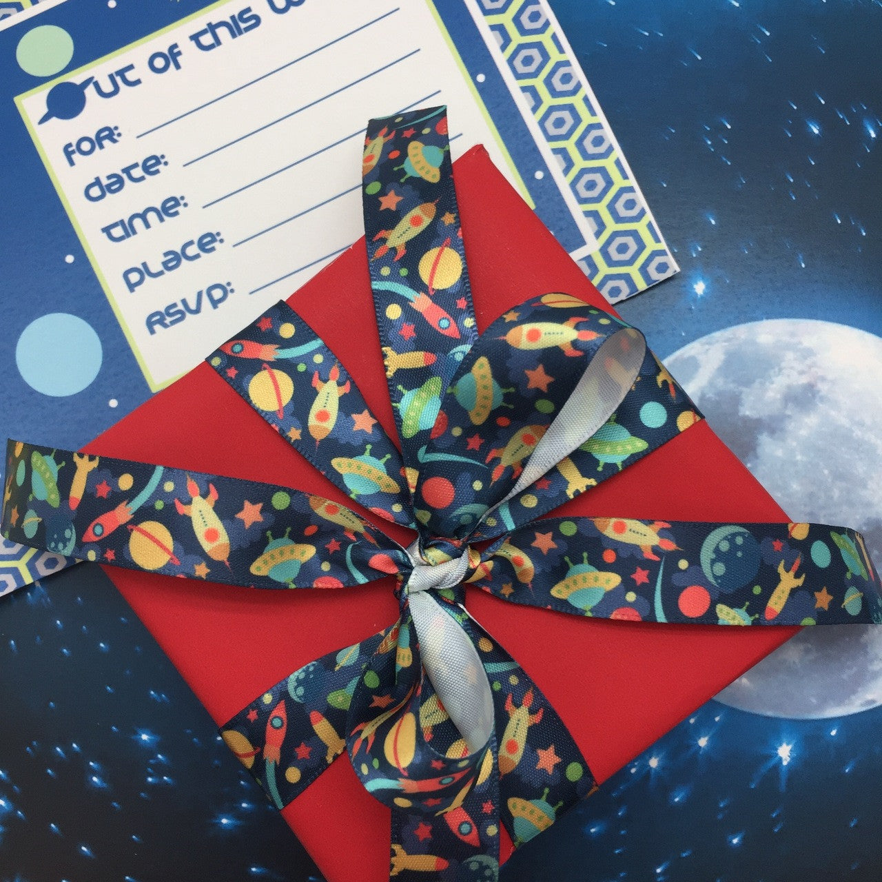 Our space ship ribbon is out of this world!  Be sure to have it on hand for Space theme birthday parties!