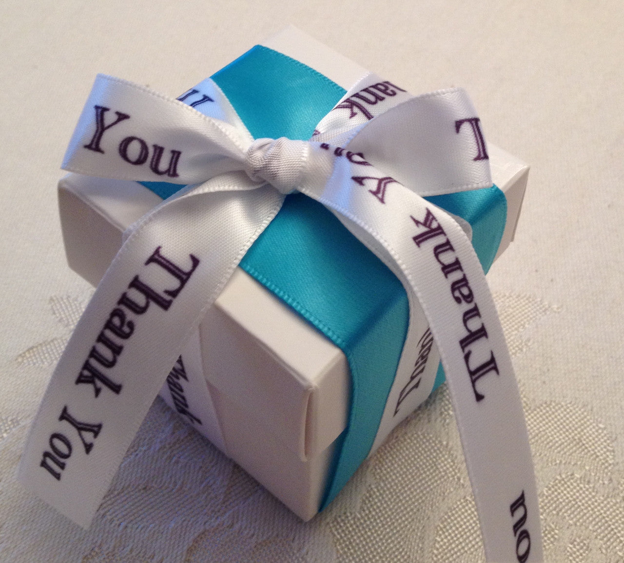 The "Tiffany" theme is so popular for weddings, engagement parties and showers. This Thank You ribbon in black and white with the blue satin complimentary ribbon is so chic!