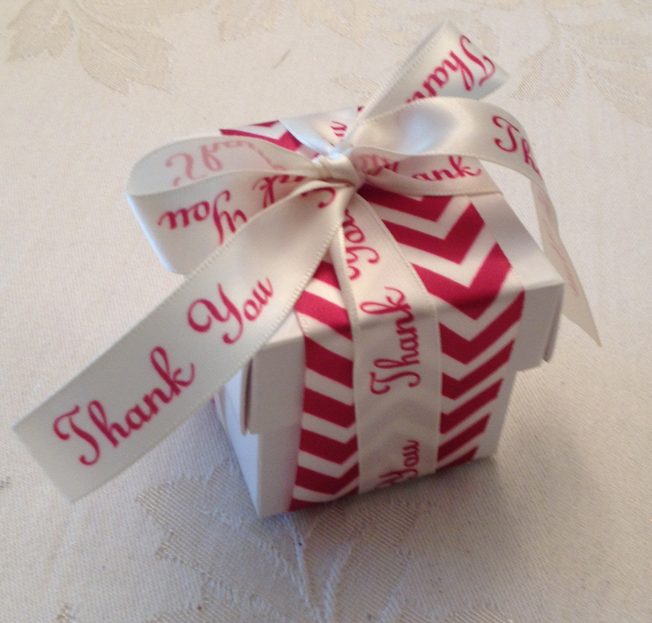 A band of our red and antique white chevron is the base for this pretty Thank You favor box. This is so fun and modern for a very fashion forward event!