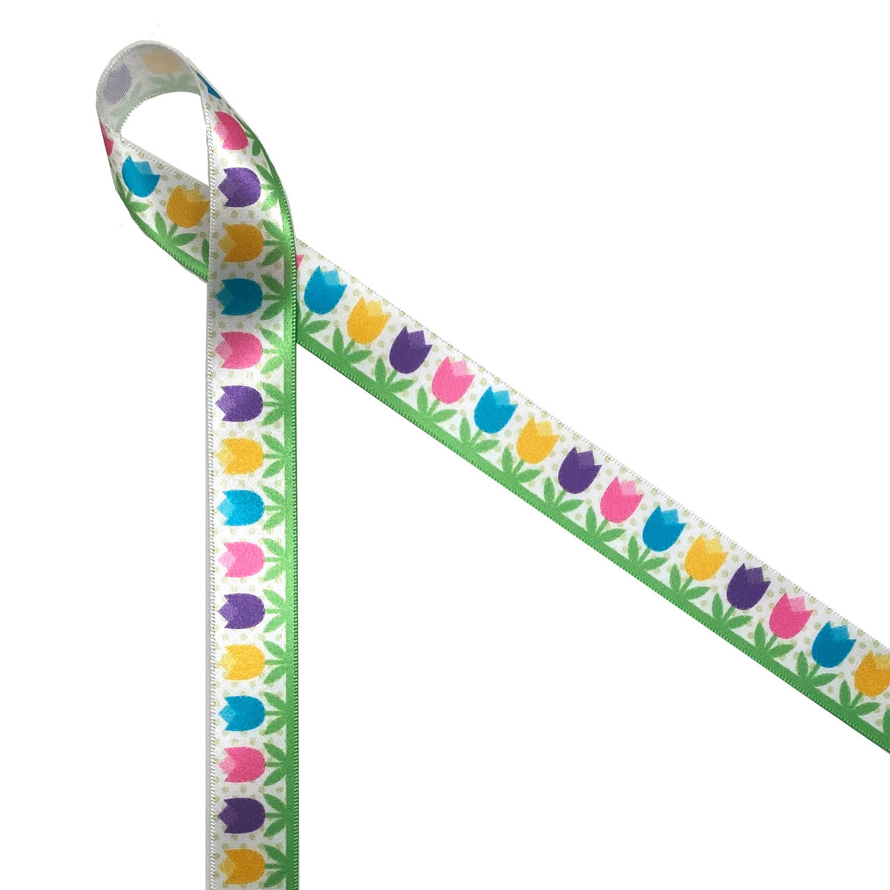Spring tulips in pretty pastel colors on a polka dot background growing in the garden on 7/8" white single face satin ribbon.