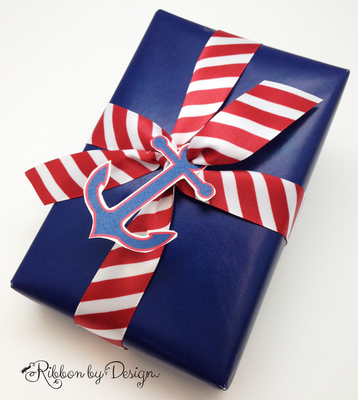 Our handsome red and white stripes are striking a nautical pose on this little gift tied with an anchor card!