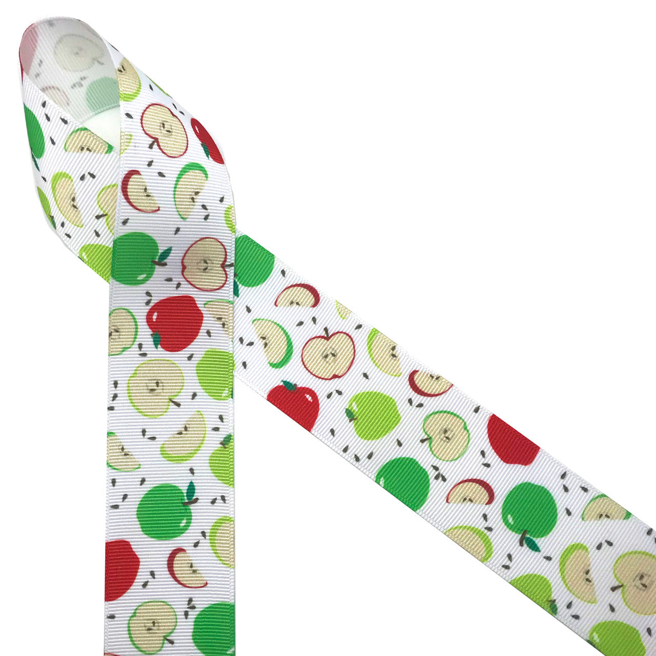 Green and red apples with brown seeds and apple slices printed on 1.5" white grosgrain ribbon is such a fun ribbon for Fall crafting! A great choice for hair bows, scrap booking and more! Designed and printed in the USA