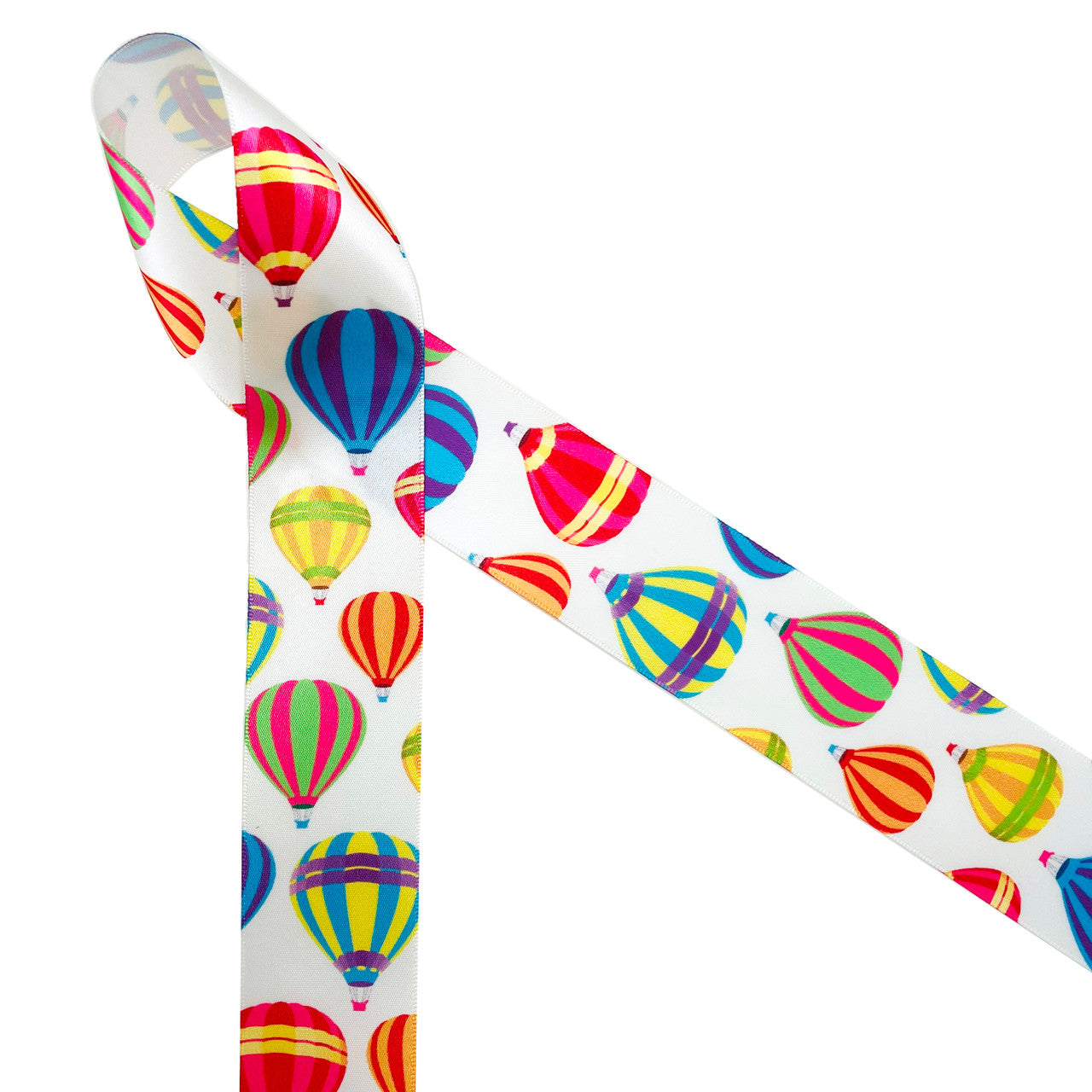 Colorful hot air balloons drift away on 1.5" white single face satin ribbon! This is an ideal ribbon for birthday parties, party decor, hair bows, head bands and quilting projects. Be sure to have this fun ribbon on hand for all your crafting needs! Our ribbon is designed and printed in the USA