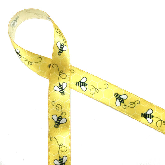 Our buzzing bees on 5/8" white single face satin ribbon are featured in black and white on a yellow background!