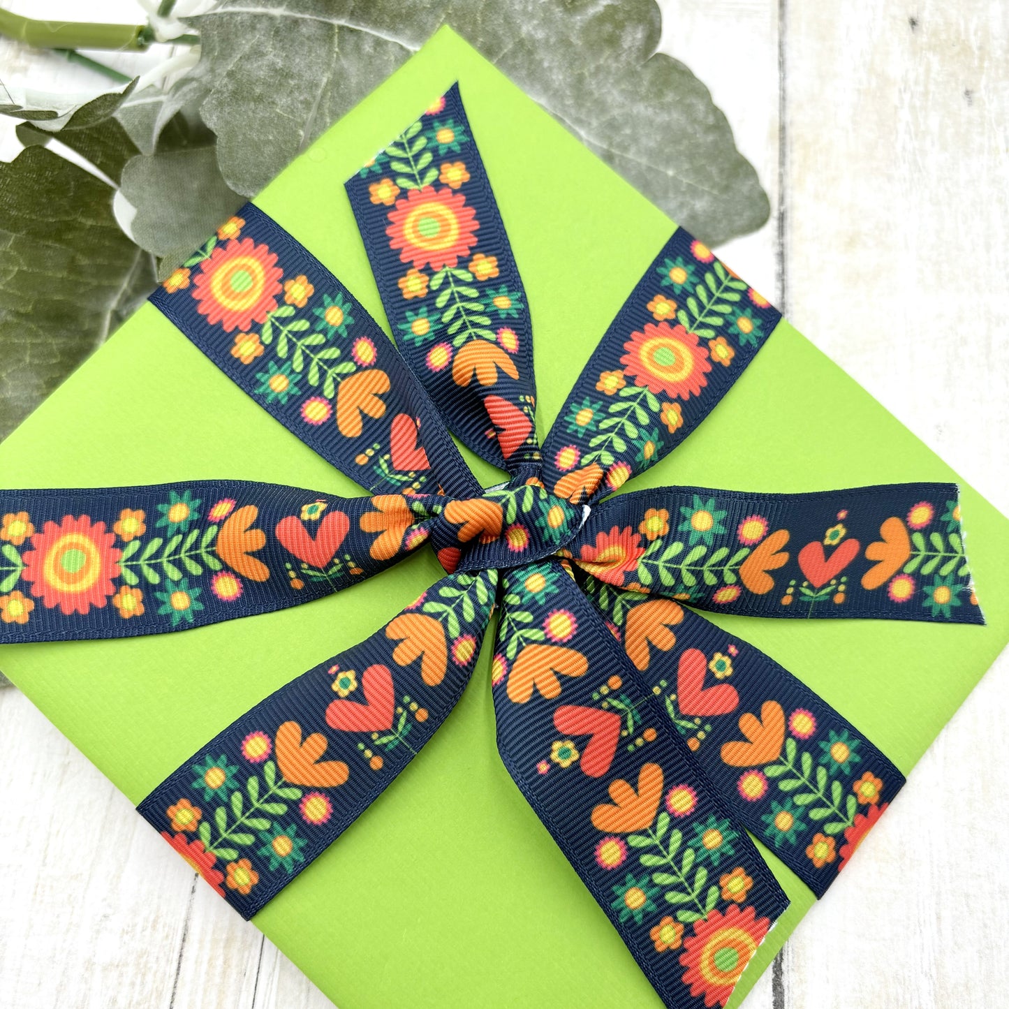 Boho Floral ribbon coral, orange, red and green flora on a navy background printed on 7/8" satin and grosgrain