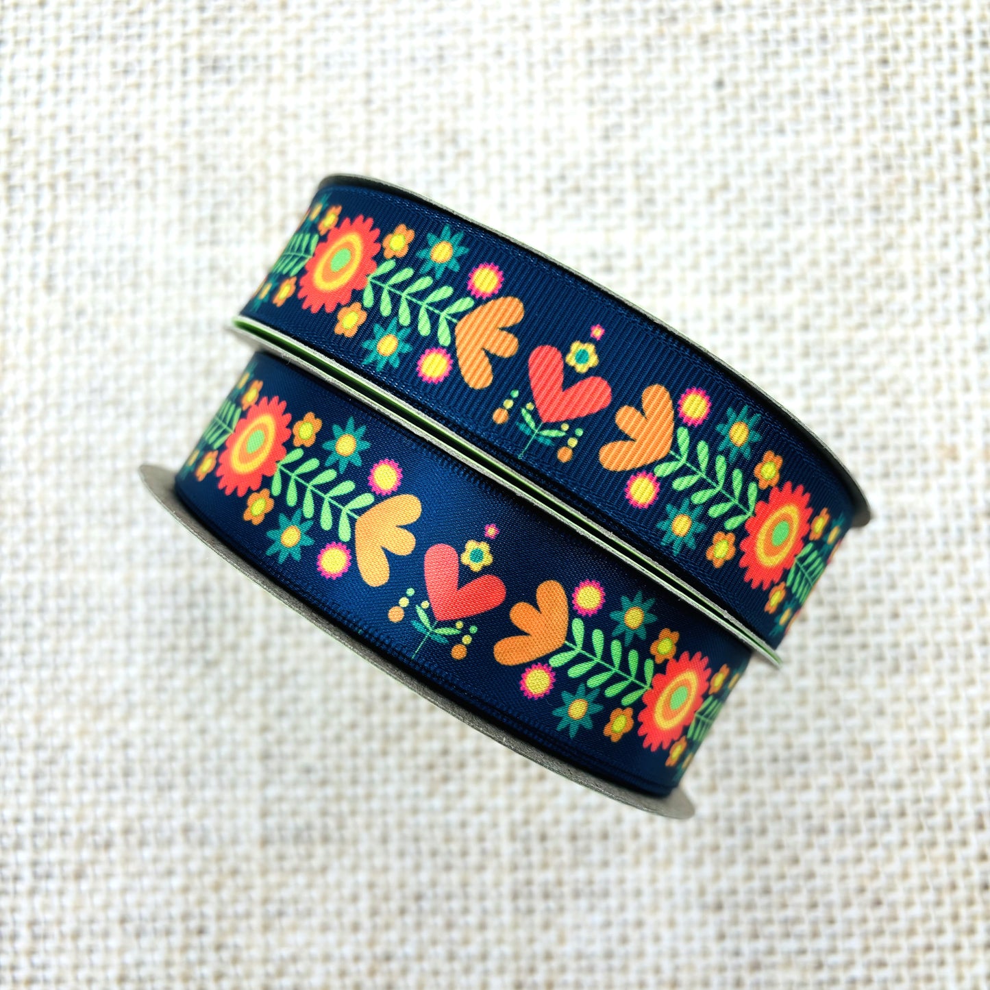 Boho Floral ribbon coral, orange, red and green flora on a navy background printed on 7/8" satin and grosgrain