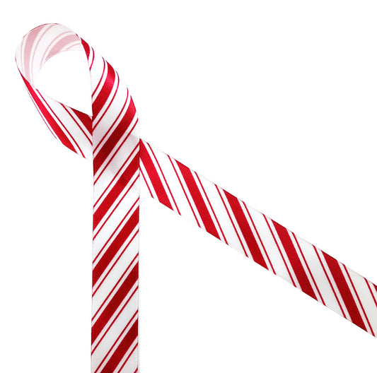 Candy cane stripe ribbon in red and white printed on 7/8" white single face satin is a Christmas classic. This is a great ribbon for gift wrap, party decor, gift baskets, cookies, cake pops, crafts, sewing and quilting projects. Be sure to have this ribbon on hand all season long! All our ribbon is designed and printed in the USA