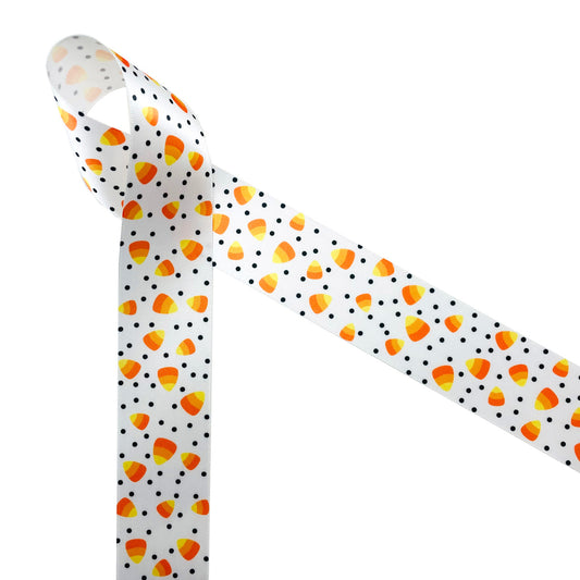 Candy corn in traditional orange, yellow and white tossed with black polka dots printed on 1.5" white single face satin is a Halloween staple! This is a fun ribbon for Halloween decor, gift wrap, Halloween wreaths, hair bows, head bands and hat bands. Use this ribbon for quilting, sewing and craft projects too! All our ribbon is designed and printed in the USA
