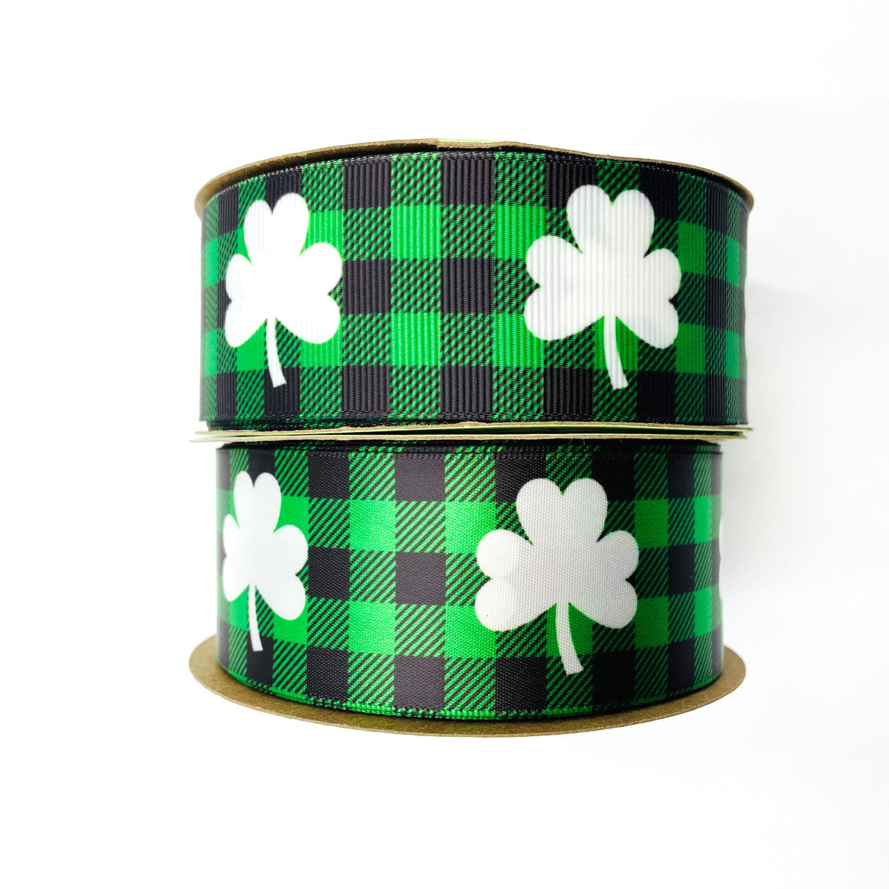 Our fun white shamrocks printed on a green and black buffalo plaid background come on satin and grosgrain!