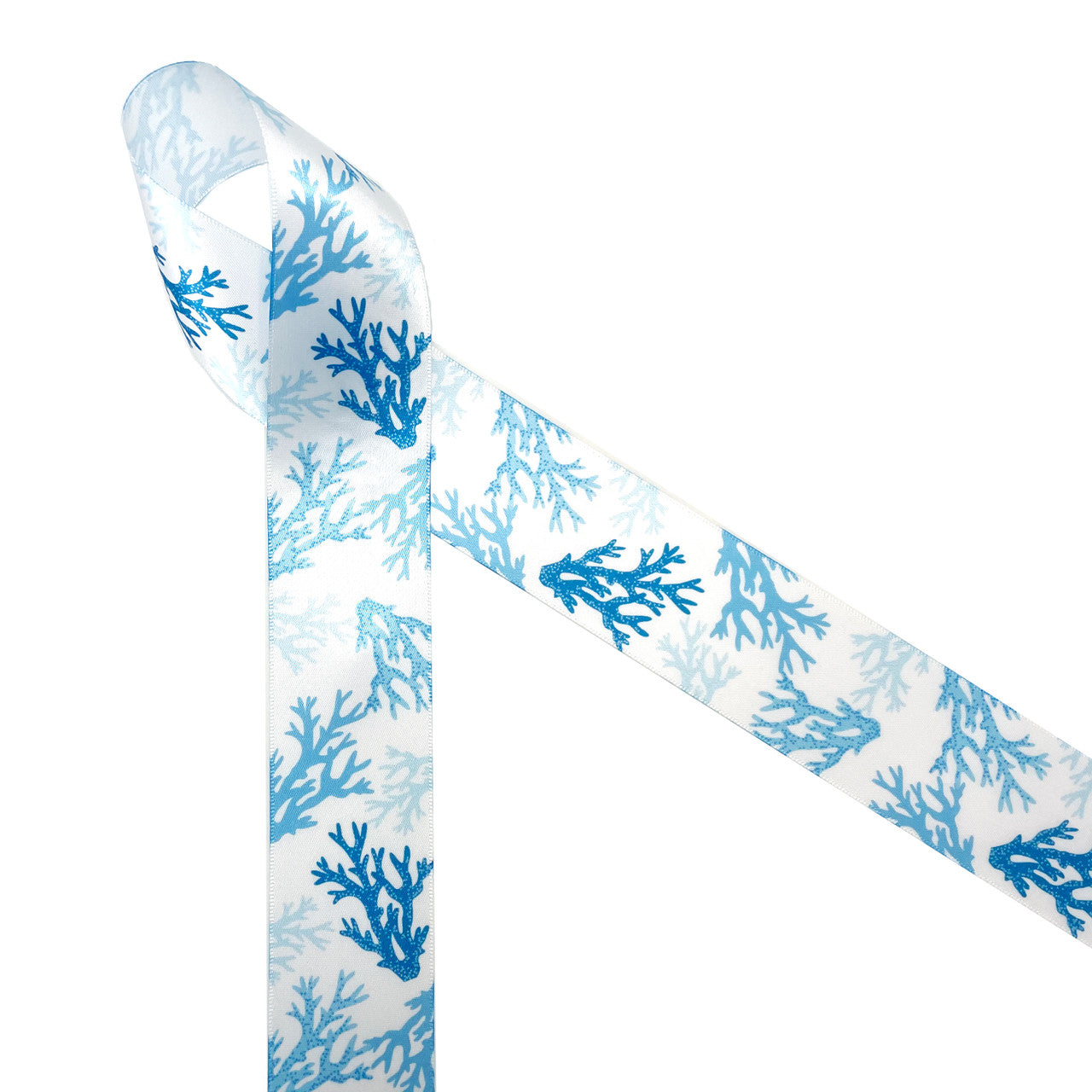 Coral Reef  patterns are trending in home decor and fashion! Our coral reef ribbon in shades of blue printed on 1.5" white single face satin is perfect for any beach, tropical or reef themed event! This is the perfect ribbon for tying gifts for a tropical themed wedding or bridal shower! Be sure to have this beautiful ribbon on hand for all you Summer crafting! Our ribbon is designed and printed in the USA