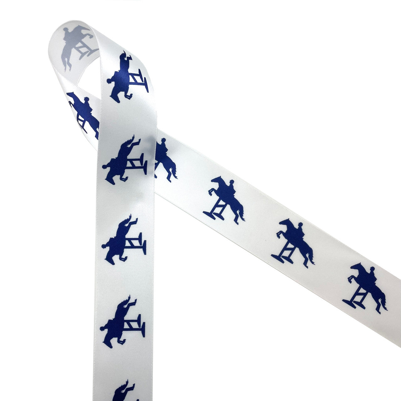 Horse jumping fences in navy blue printed on 1.5" white satin ribbon is ideal for the equestrian in your life. This classic design is perfect for pony finals ribbons, hair bows, horse shows, head bands, party decor, floral design and craft projects. Be sure to have this ribbon on hand for quilting and sewing projects too! All our ribbon is designed and printed in the USA
