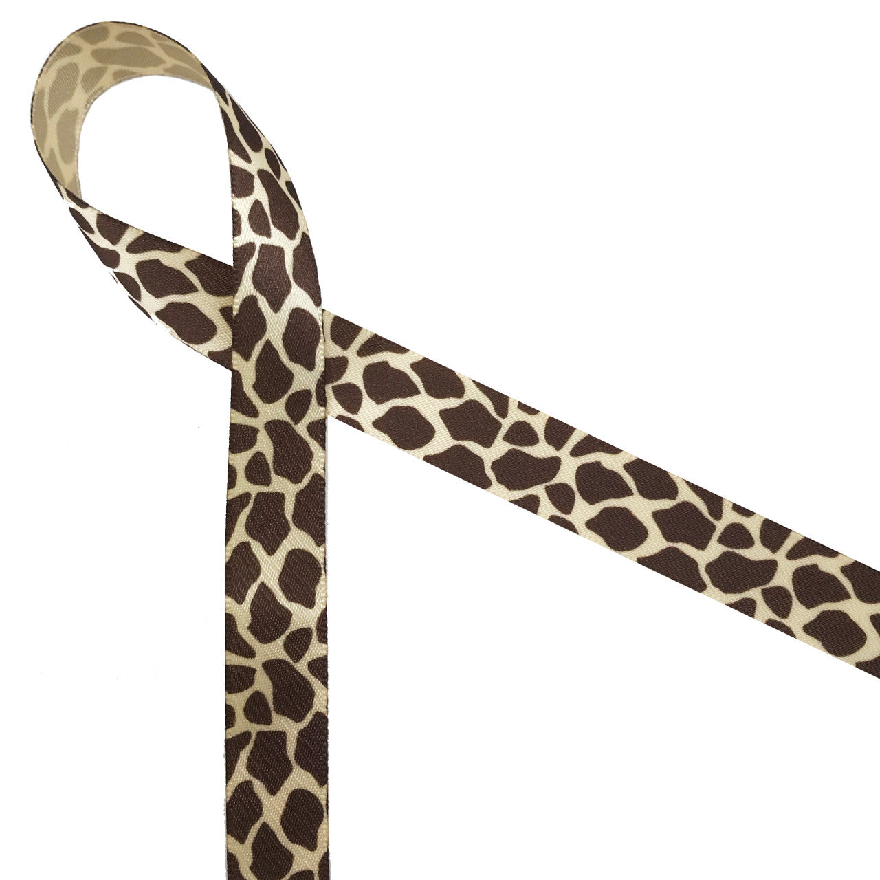 Giraffe print on 5/8" tan single face satin.