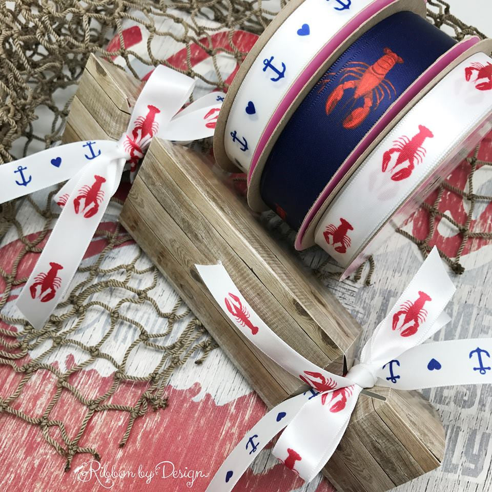 Lobster Ribbon, red on a navy background on 7/8" white single face satin