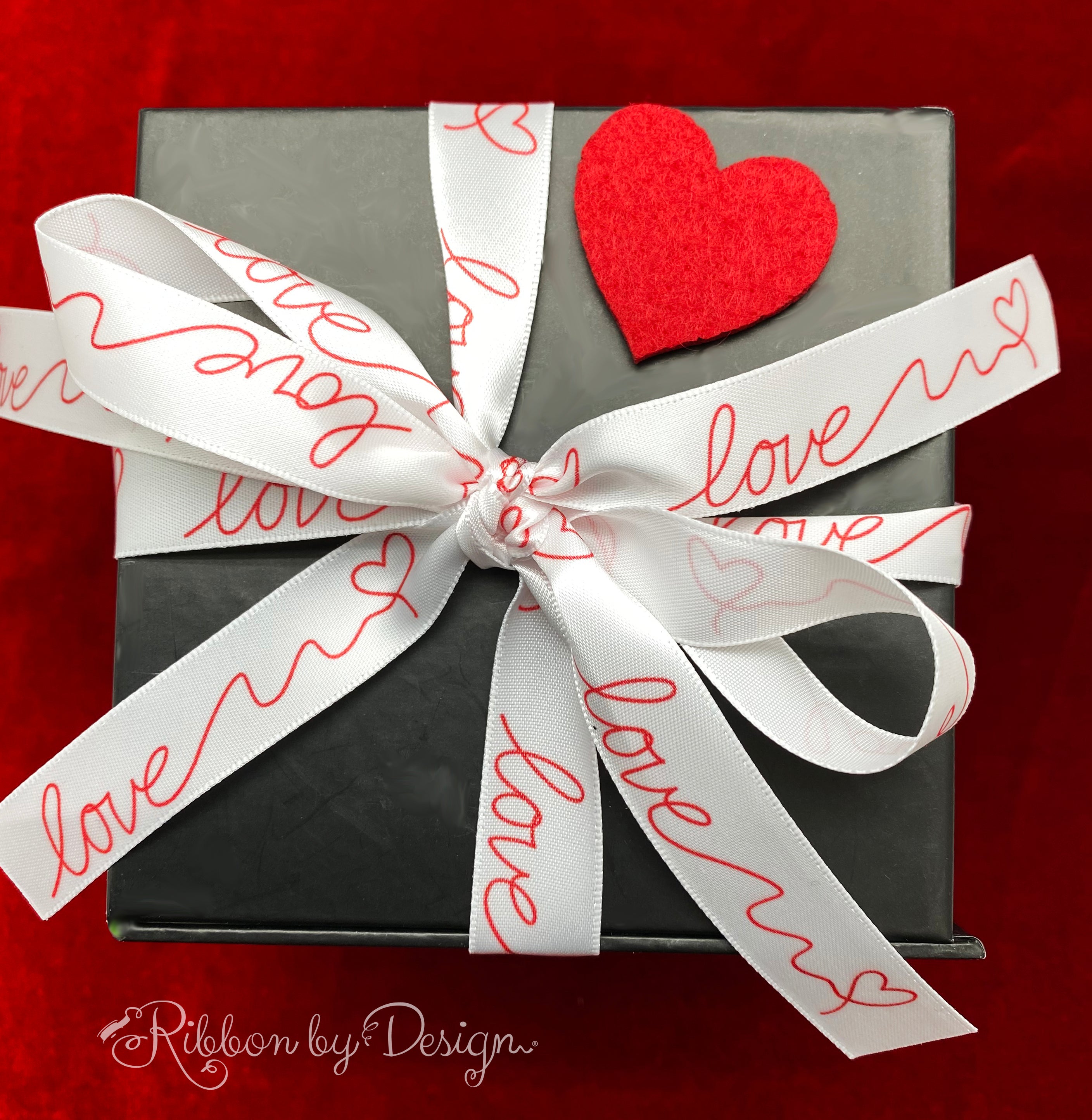 Love in swirly script written in red on 5/8