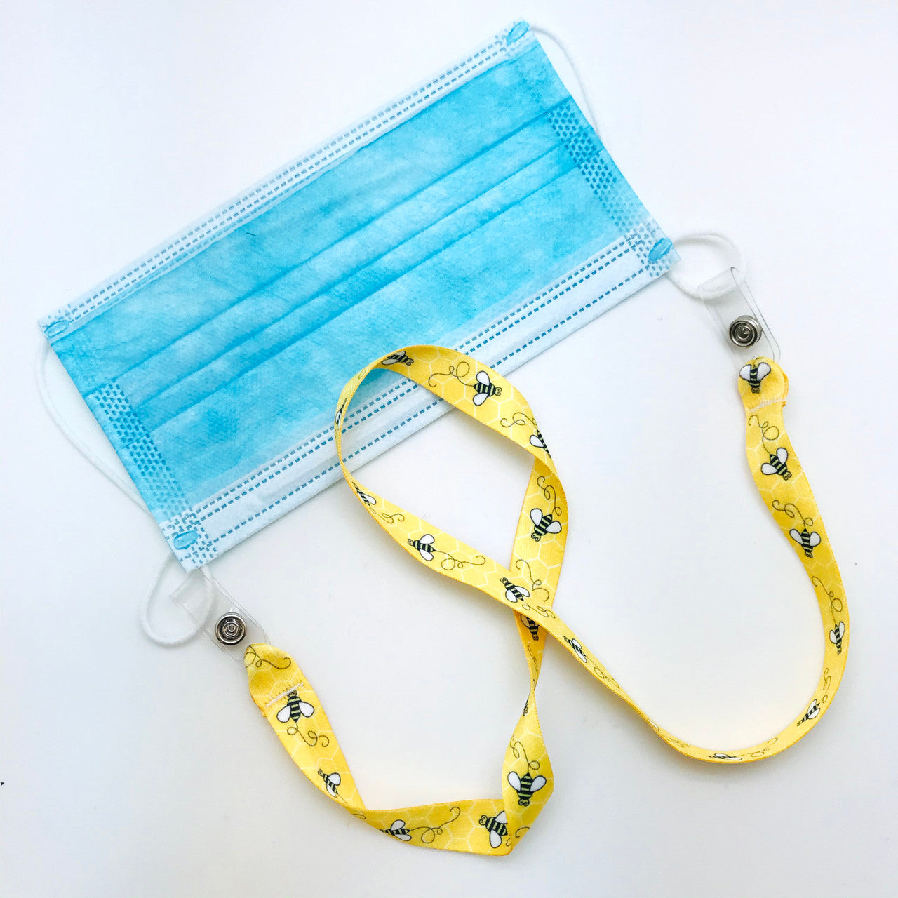 Attach the simple snap on both of the face mask loops and simply slip over the head to never lose track of your mask!
