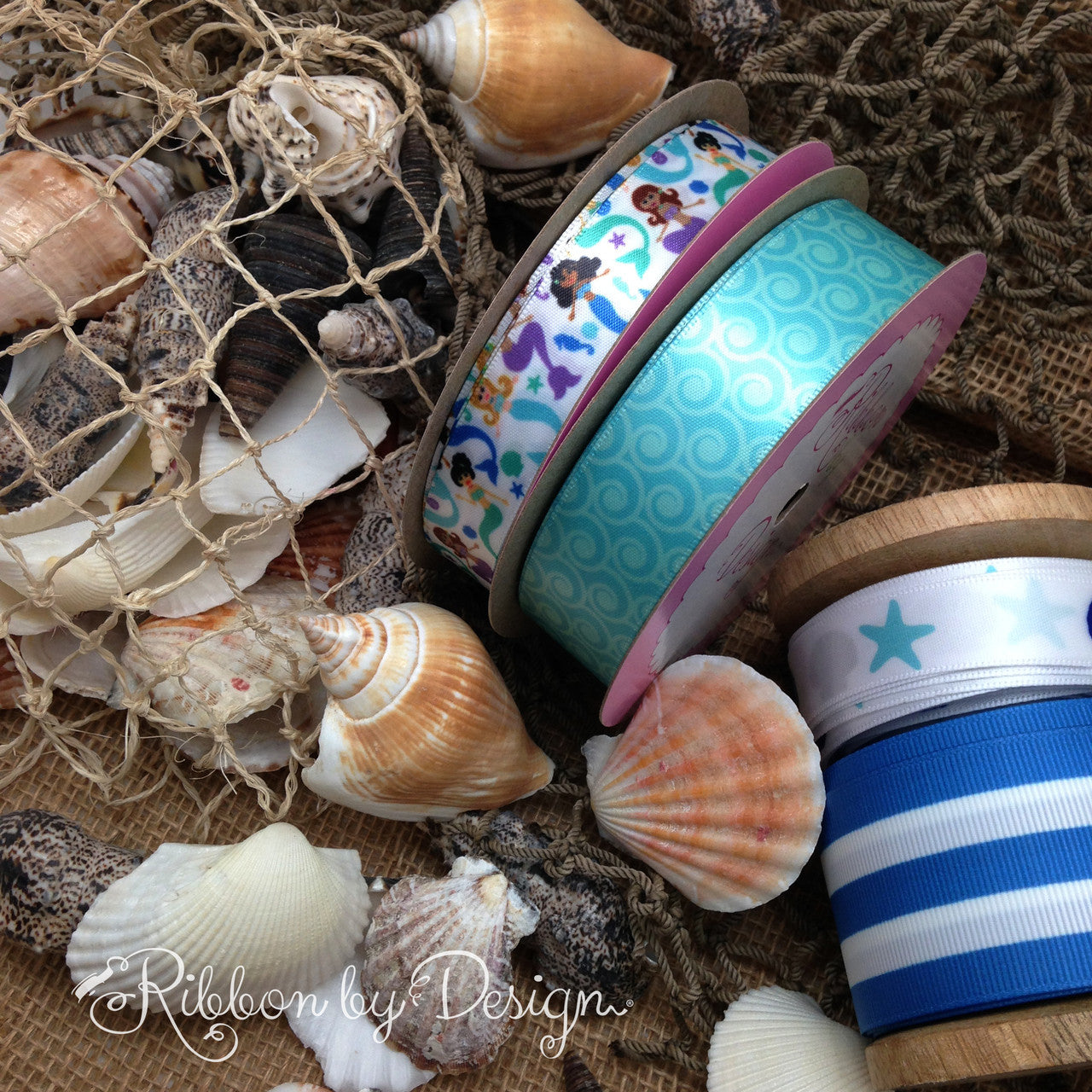Our mermaids mix and match with many of the ribbons in our Nautical Collection to create an interesting vignette!