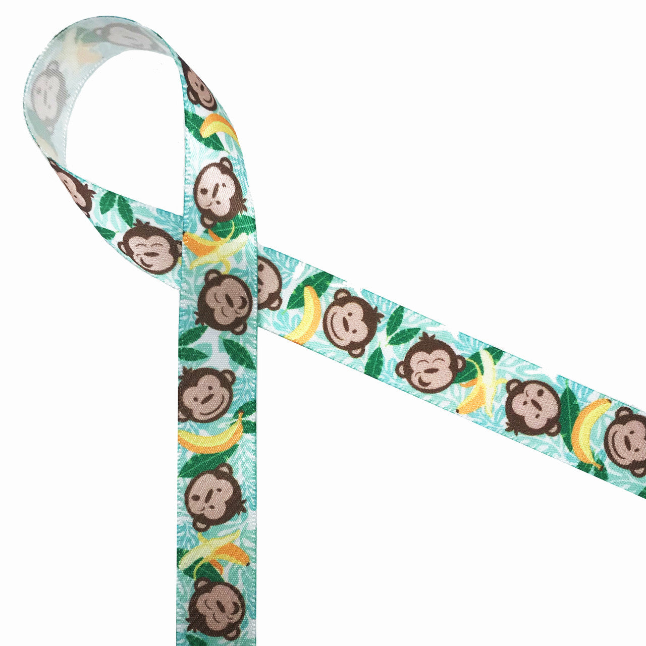 Monkey faces and bananas tossed on a background of green palm fronds on ...