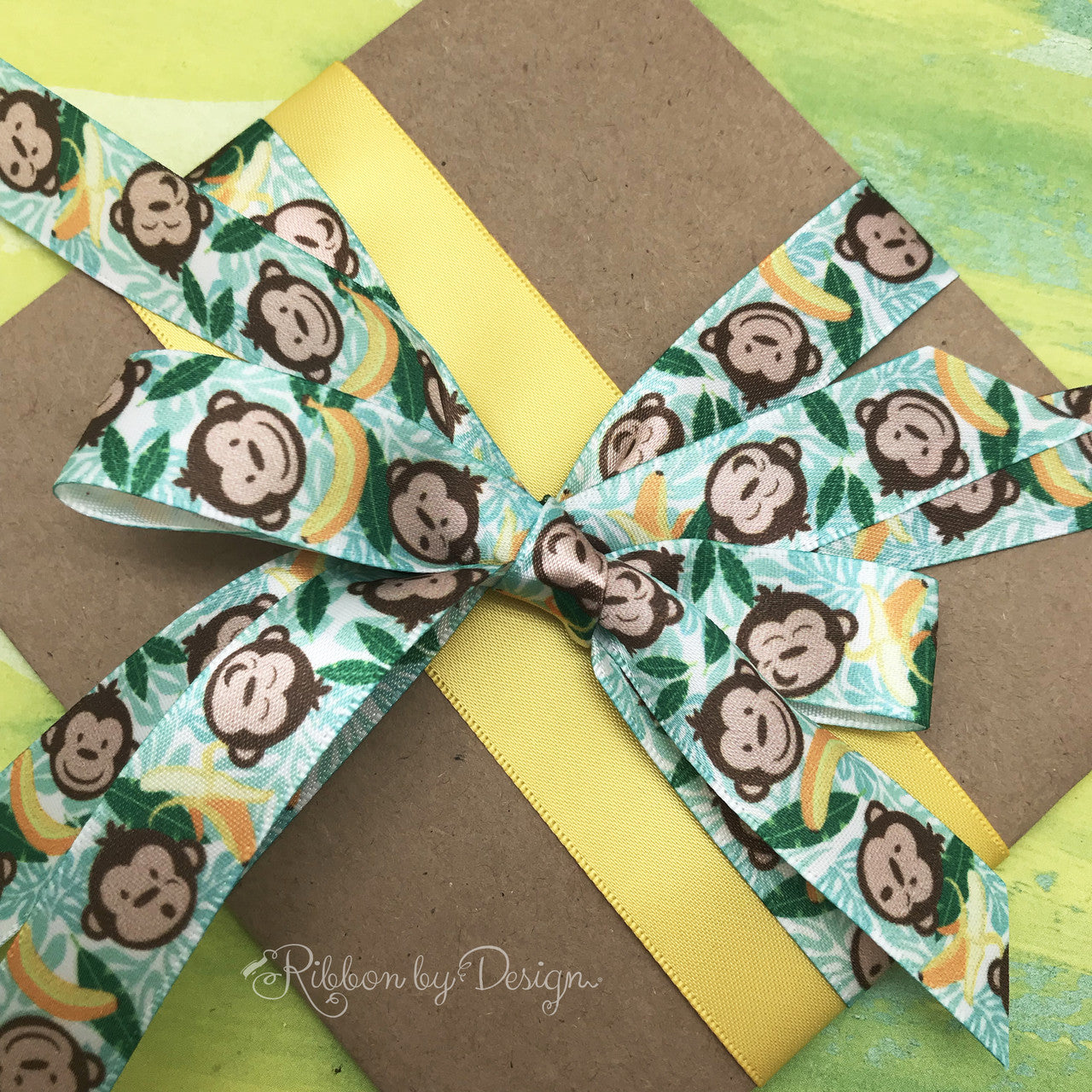 This fun little package is paired with a yellow 1/5" satin ribbon to really make the pattern pop! Combining ribbons on a single package makes for some very interesting gift wrap!