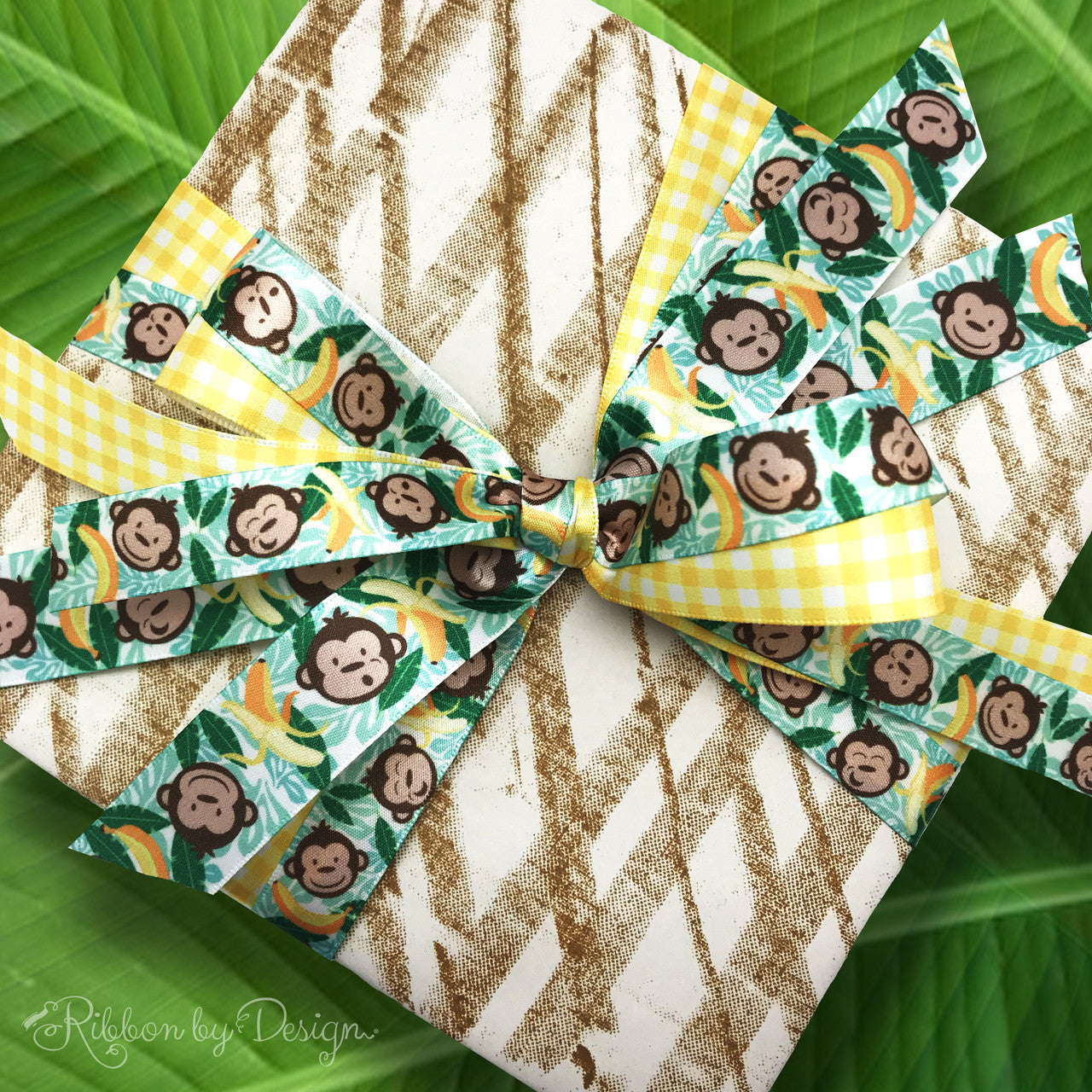 This fun little package is paired with a yellow gingham ribbon to really make the pattern pop! Combining ribbons on a single package makes for some very interesting gift wrap!