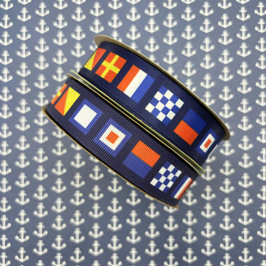 Nautical Flag ribbon flags spell NEWPORT with a navy blue background printed on  7/8" white satin and grosgrain