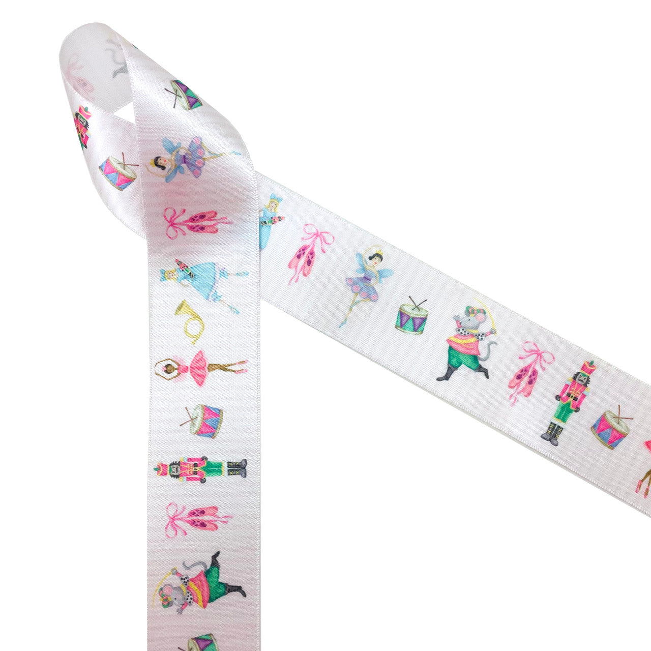 Nutcracker suite ribbon featuring all the characters in the ballet printed on 1/5" white single face satin. This ribbon is ideal for ballet schools, ballerinas, gift wrap, gift baskets, holiday crafts, sewing projects, and quilting. Be sure to have this ribbon on hand for all your Holiday events!  All our ribbon is designed and printed in the USA