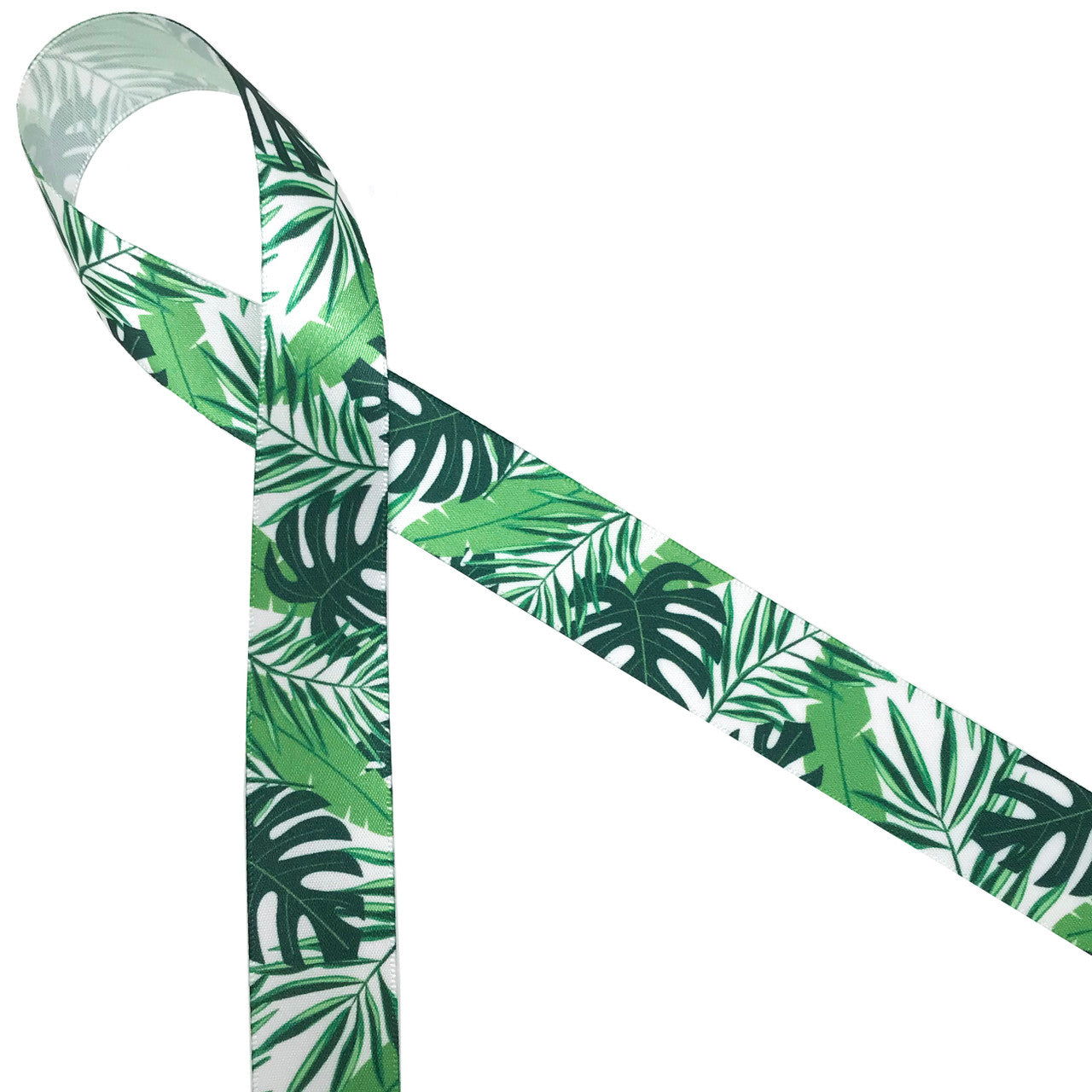 Palm fronds, banana leaves and ferns on 7/8" white single face satin is  a wonderful addition to a tropical themed event!