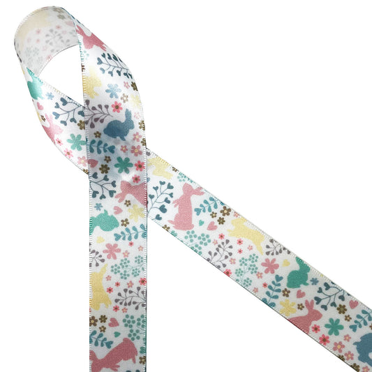 Pastel bunnies in blush pink, yellow, and teal are tossed with floral and fern printed on 7/8 white single face satin ribbon. This soft palette is perfect for Easter wreaths, Easter baskets, Easter floral designs, Spring wreaths, table decor, quilting and sewing. Be sure to  have this ribbon on hand for all your Spring  crafts. All our ribbon is designed and printed in the  USS