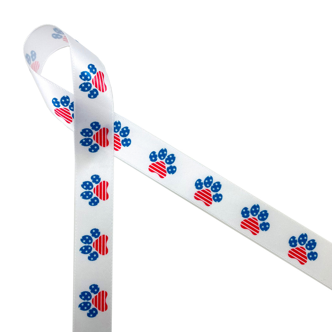 Patriotic paw prints in red, white and blue and stars and stripes printed on 7/8" white single face satin is a fun ribbon for celebrating the 4th of July with your furry friends. This is a fun ribbon for hair bows, head bands, gift wrap, gift baskets, party decor, table decor and party favors. Be sure to have this ribbon on hand for pet themed crafts, sewing and quilting projects too! All our ribbon is designed and printed in the USA
