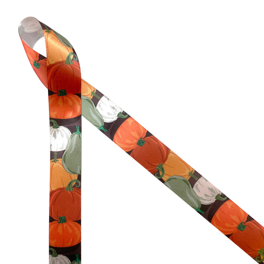 Pumpkins and gourds in orange, green and white on a brown background printed on 7/8" white single face satin ribbon is perfect for all your Fall decorating needs. This is a fun ribbon for gift wrap, wreaths, party decor, interior decor, floral design and quilting projects. Be sure to have this ribbon on hand for the Thanksgiving table too! All our ribbons are designed and printed in the USA