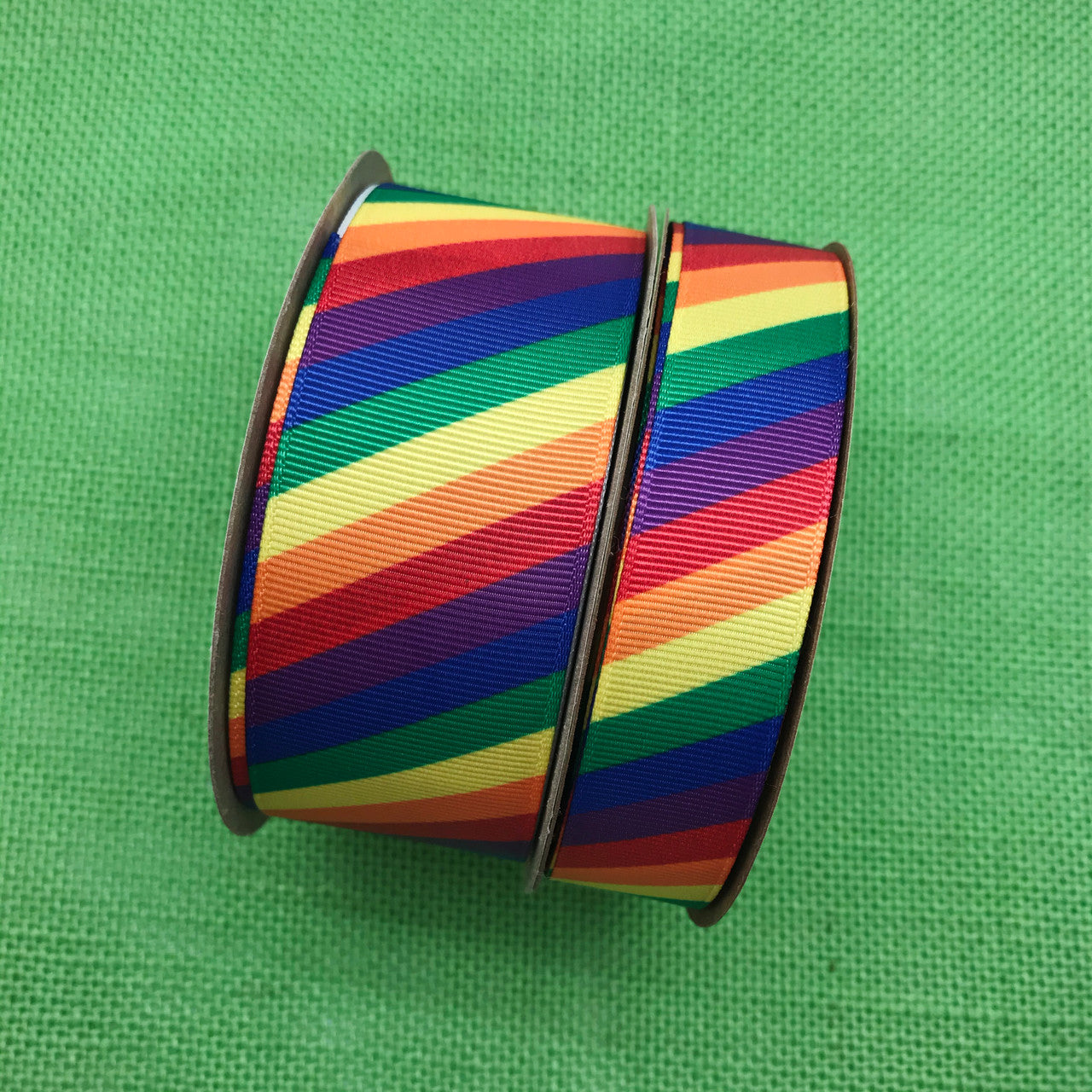 Our rainbow stripes in primary colors come in two sizes for your crafting projects large and small. We offer this grosgrain ribbon in 1.5" and 7/8" widths.