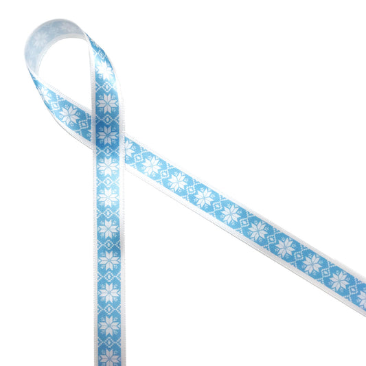 Nordic design snowflakes on and ice blue background printed on 5/8" white single face satin  ribbon is an ideal ribbon for Holiday and Winter themed gifts, parties and favors. Tie this ribbon on cookies, cake pops and candy treats to make a sweets table a Winter Wonderland! All our ribbons are designed and printed in the USA