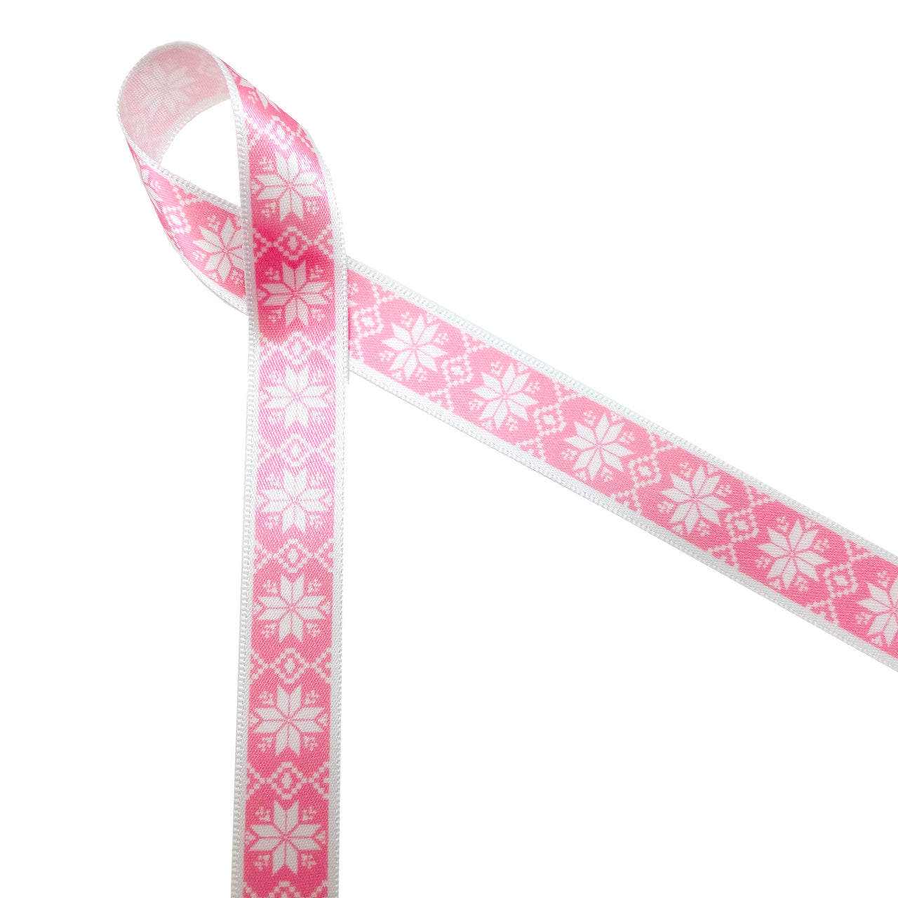 Nordic design snowflakes on a pink background printed on 5/8" white single face satin  ribbon is an ideal ribbon for Holiday and Winter themed gifts, parties and favors. Tie this ribbon on cookies, cake pops and candy treats to make a sweets table a Winter Wonderland! All our ribbons are designed and printed in the USA