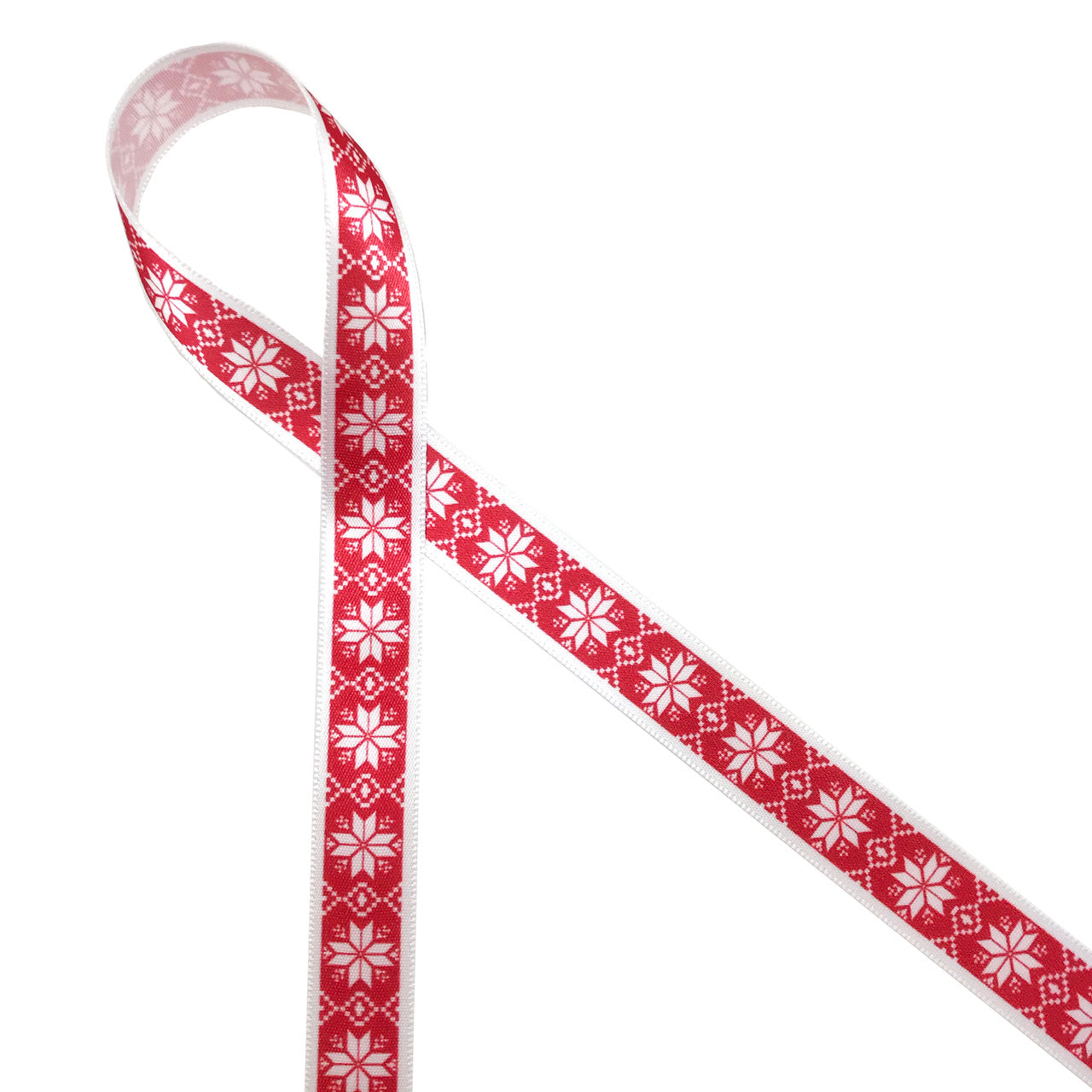 Nordic design snowflakes on a red background printed on 5/8" white single face satin  ribbon is an ideal ribbon for Holiday and Winter themed gifts, parties and favors. Tie this ribbon on cookies, cake pops and candy treats to make a sweets table a Winter Wonderland! All our ribbons are designed and printed in the USA